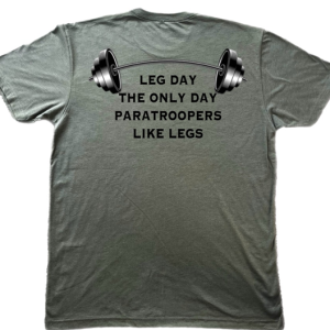 Custom-designed t-shirt that has a picture of barbells and the text saying "leg day the only day paratroopers like legs."