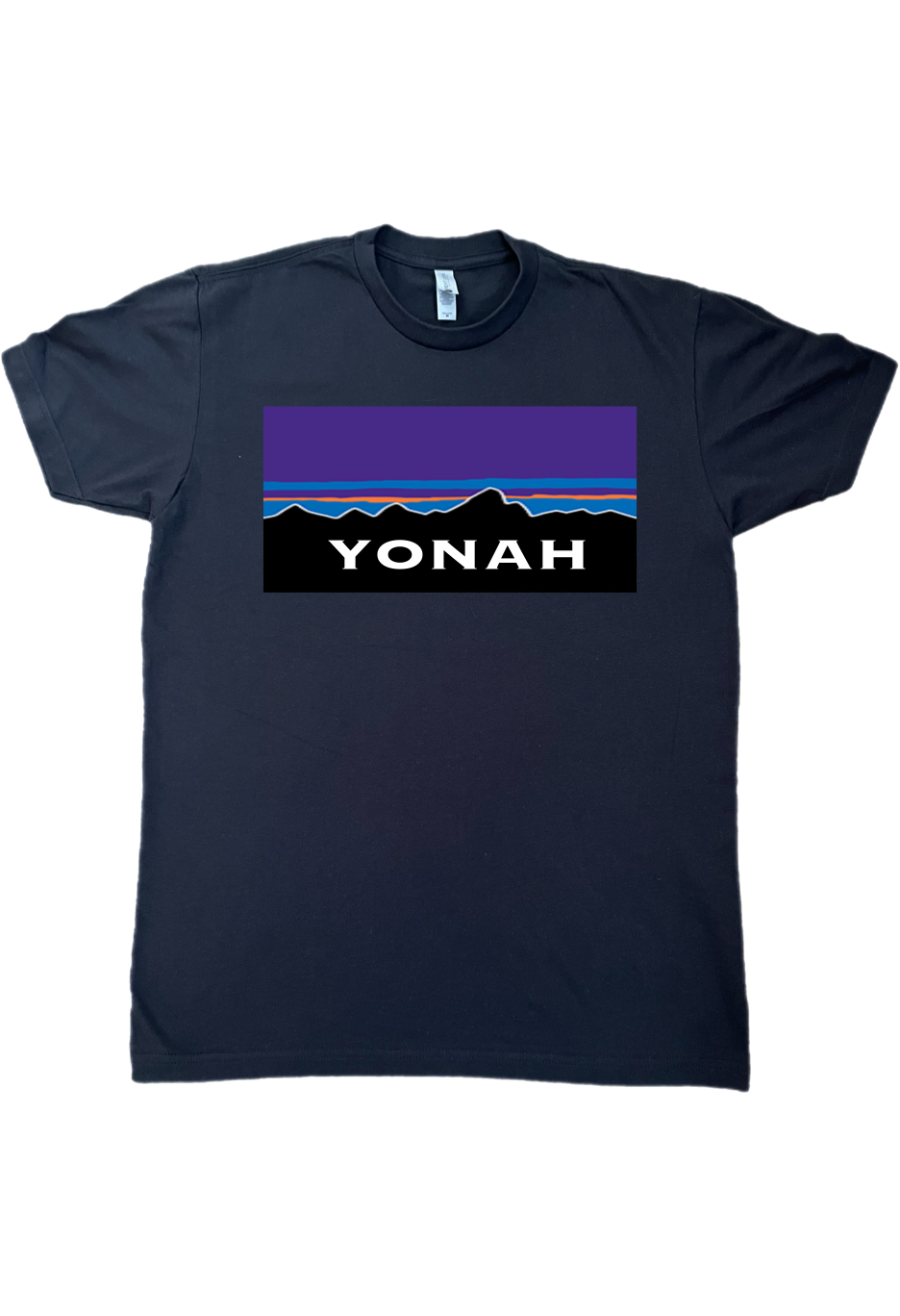 Yonah Ranger Tee T-Shirt that displays mountain ranges in the background and the word Yonah printed on it.