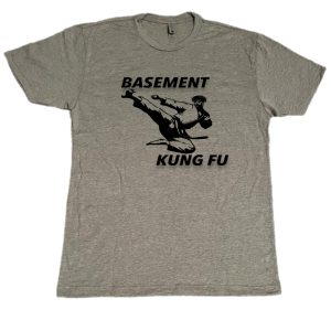 T-shirt with a picture of a guy performing a Kung Fu kick with the words Basement Kung Fu printed on the front.